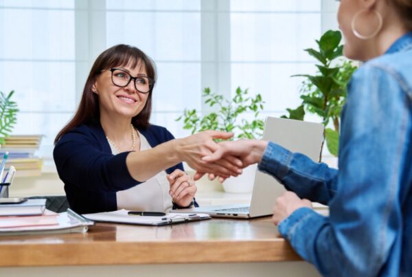 Female buyer and seller agreeing on vendor finance