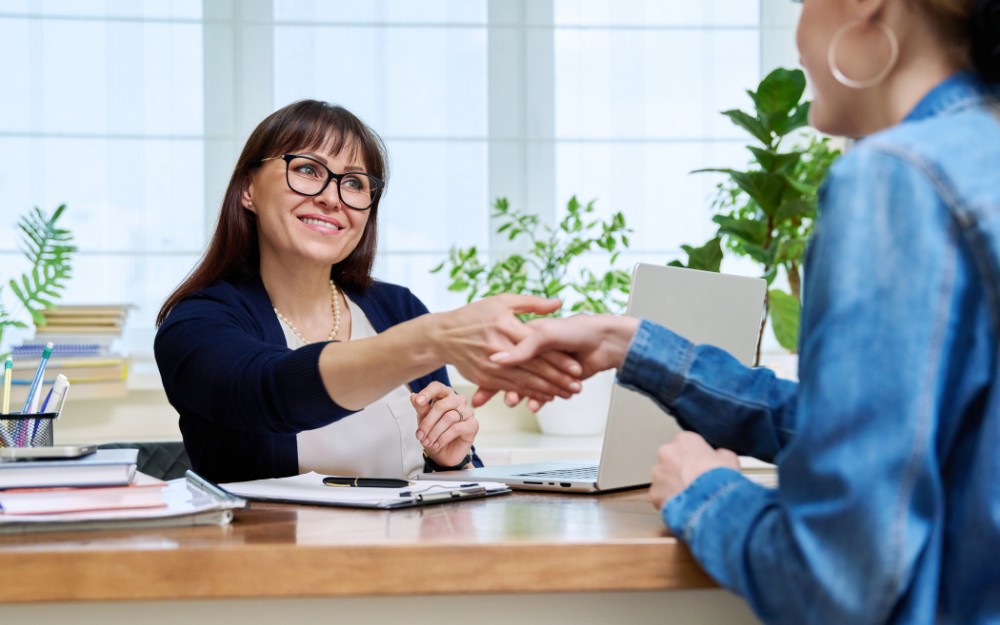 Female buyer and seller agreeing on vendor finance