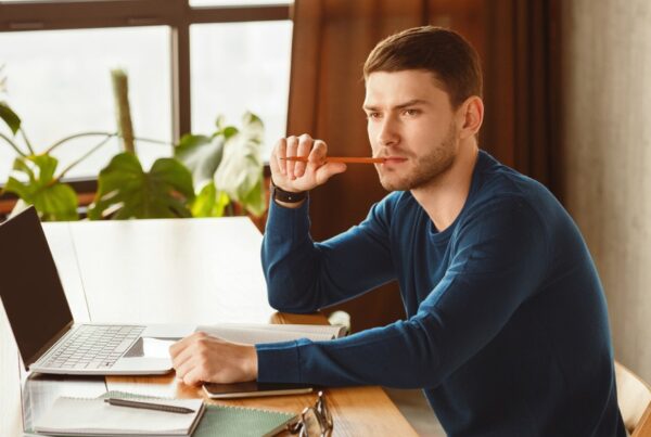 Young businessman thinking about when to write a Will