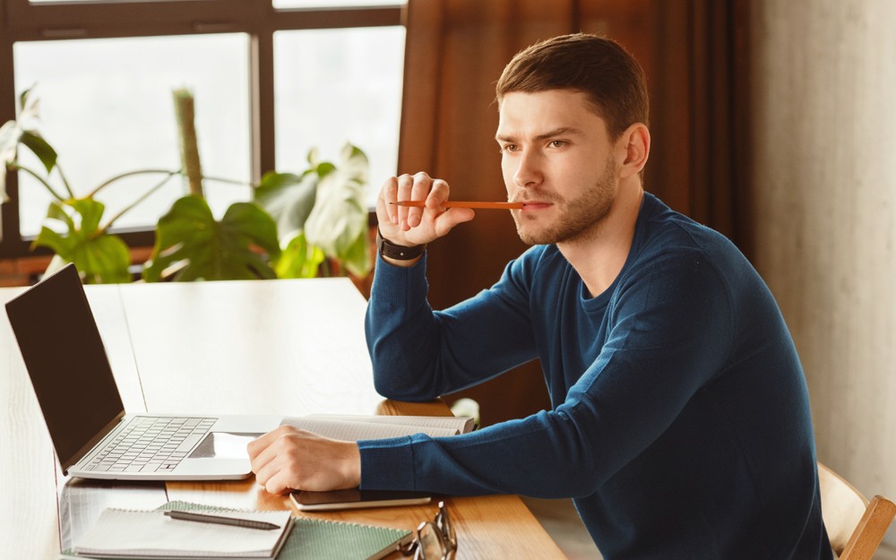 Young businessman thinking about when to write a Will