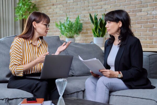 Woman talking to a lawyer about severing joint tenancy