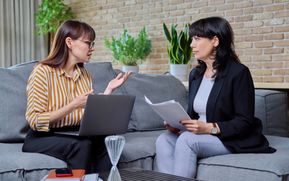 Woman talking to a lawyer about severing joint tenancy